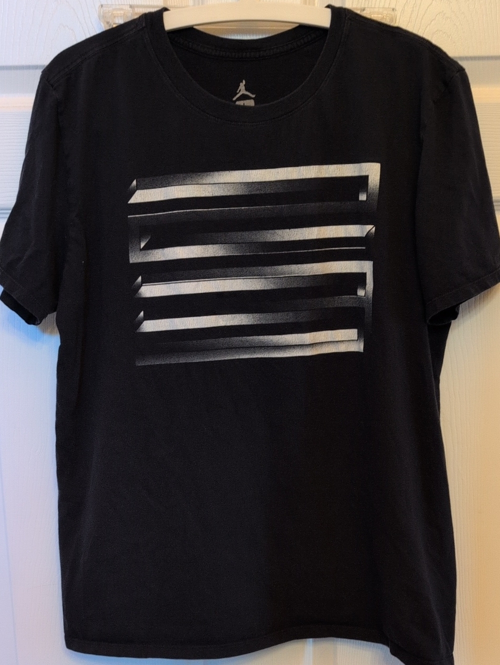 Jordan Black Short-Sleeve Tee with Silver Striped Chest Graphic